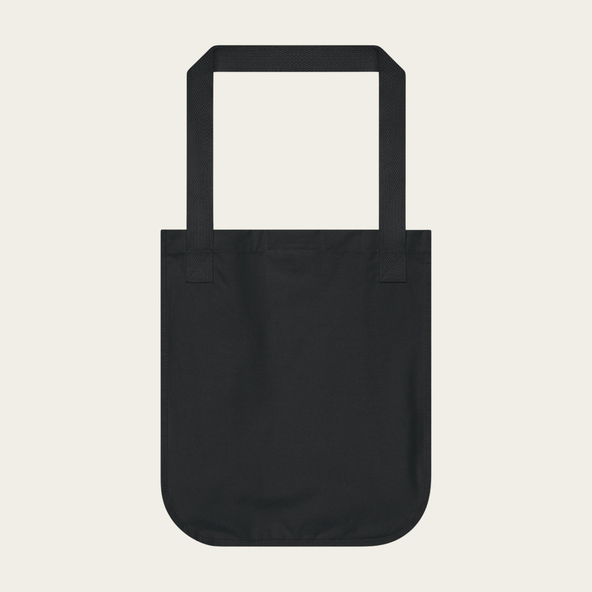 Black canvas tote bag with wide handles, open top.