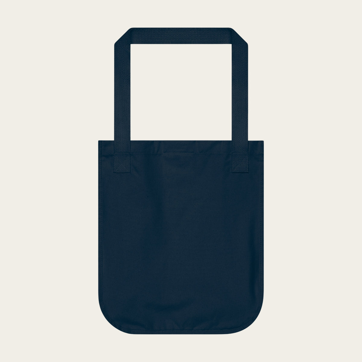 Navy canvas tote bag with wide handles, open top.