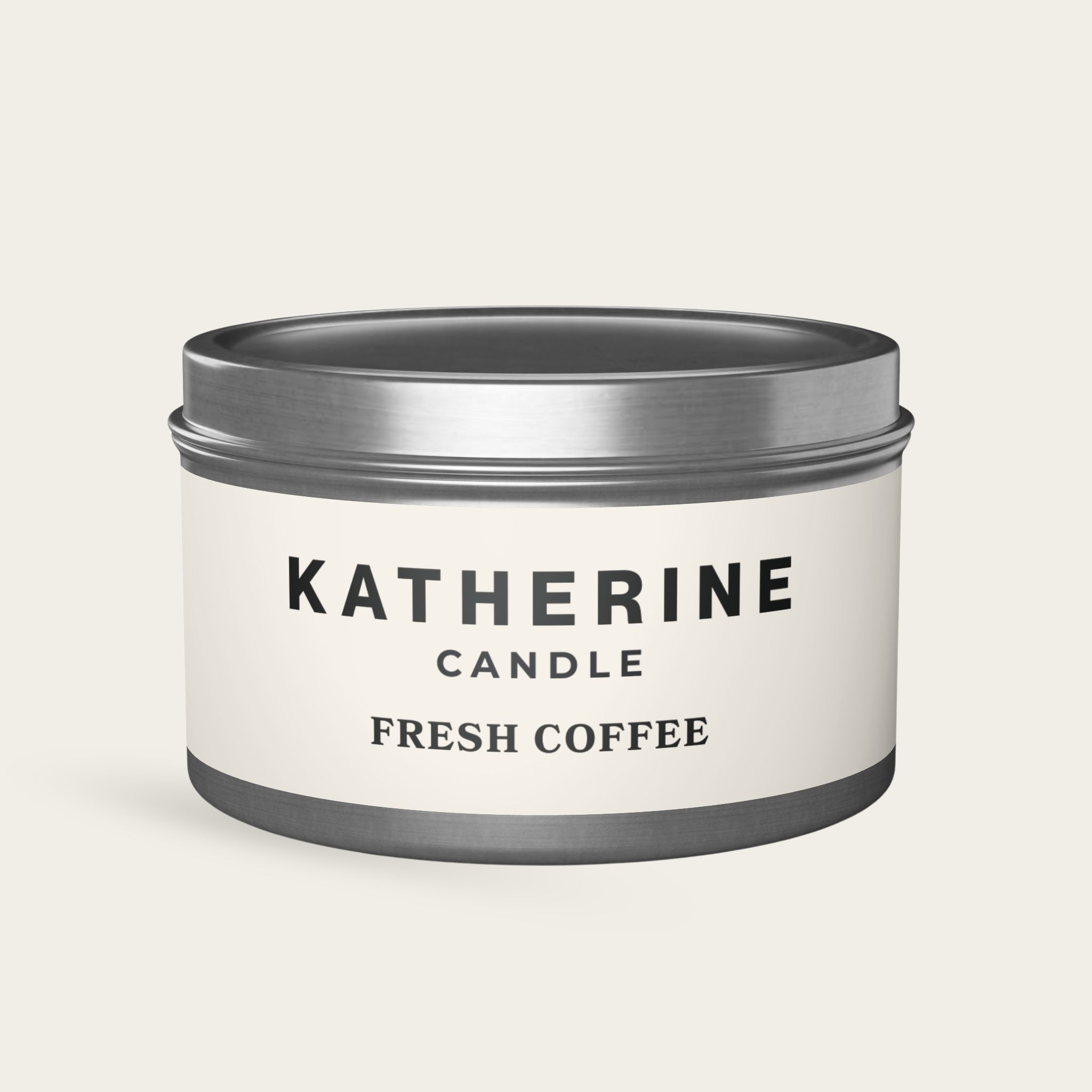 Coffee-scented candle in silver metal jar with KATHERINE CANDLE Fresh Coffee text