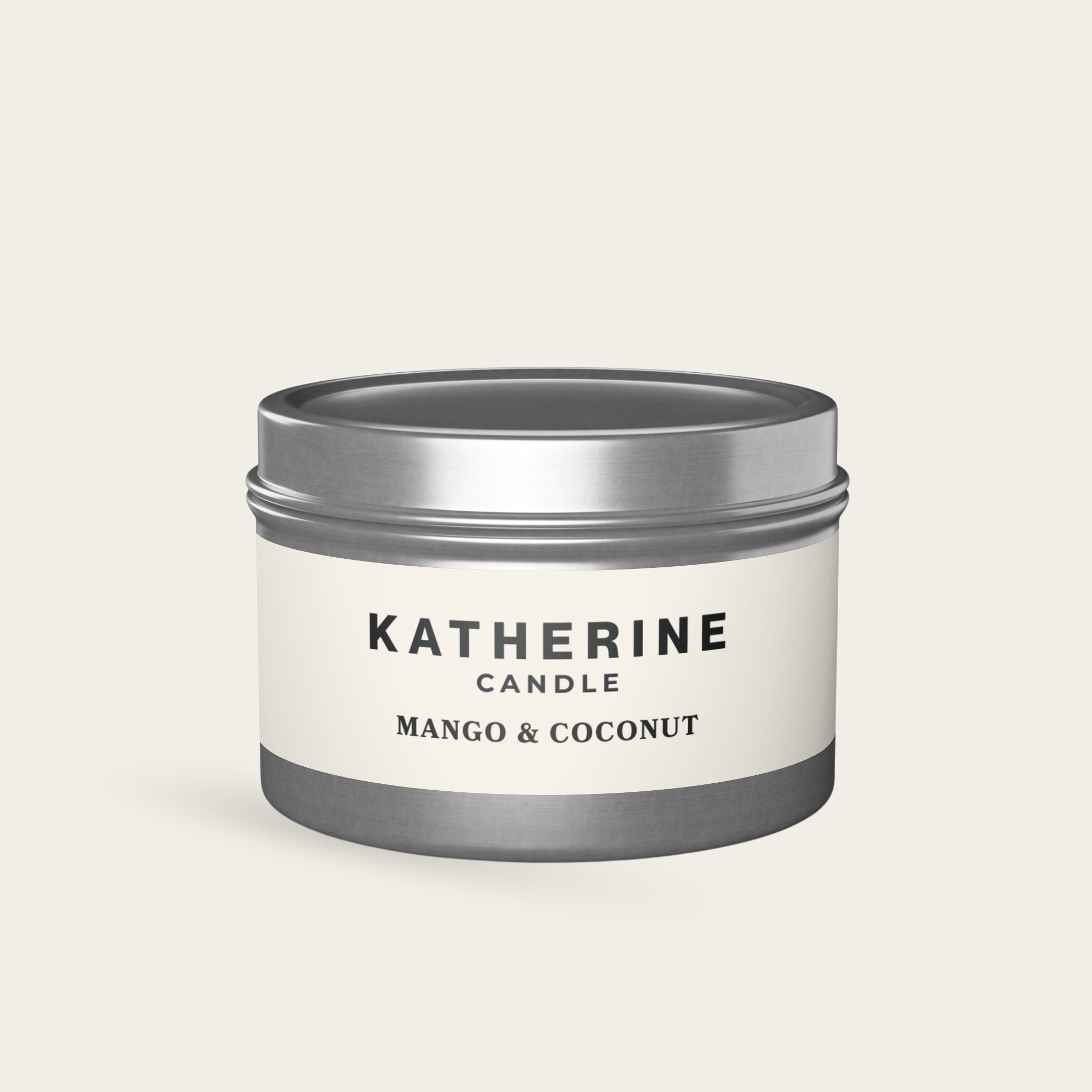 Mango & coconut candle jar with silver metal lid, white label with KATHERINE CANDLE