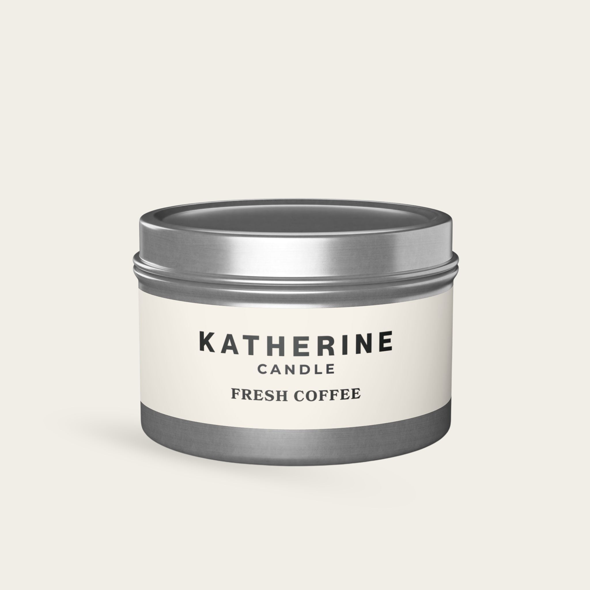 Coffee-scented candle in silver metal jar with label band and branding