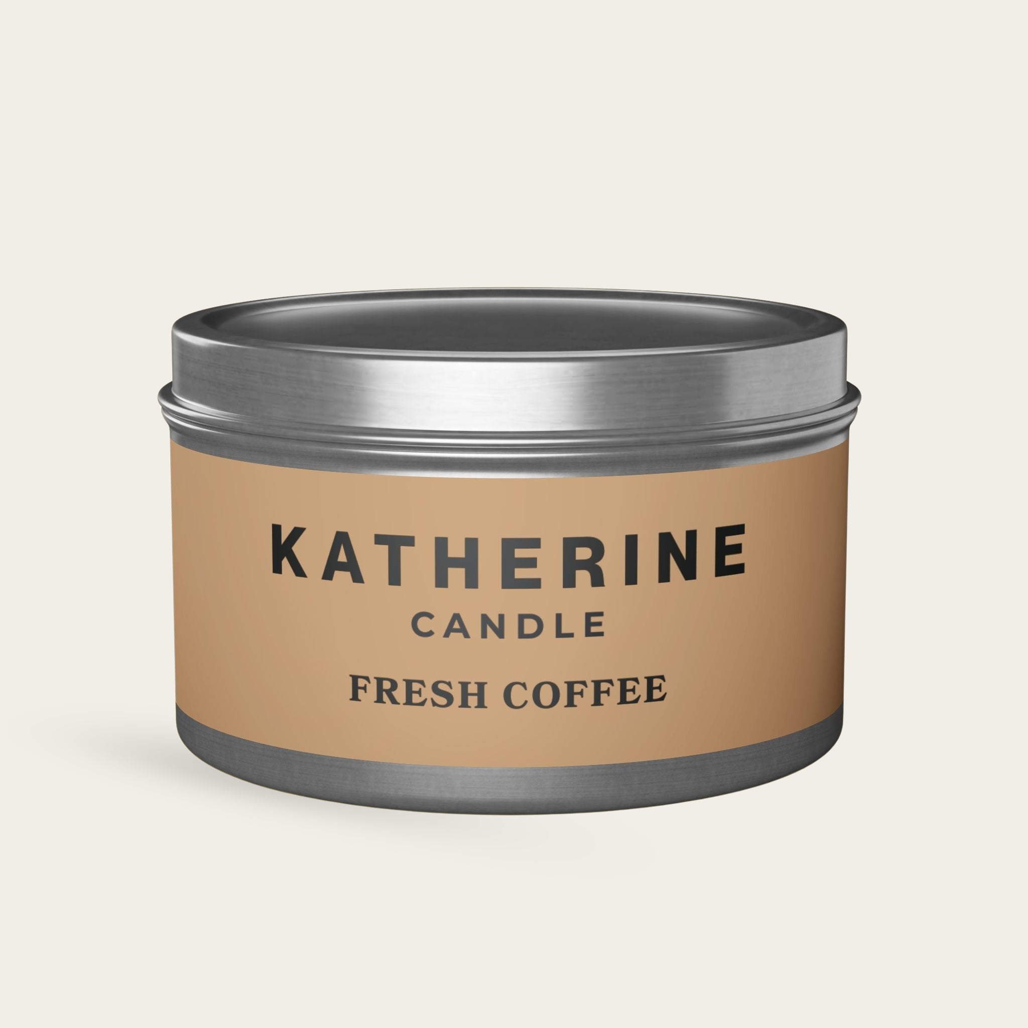 Silver candle jar with beige label reading KATHERINE FRESH COFFEE and gray base