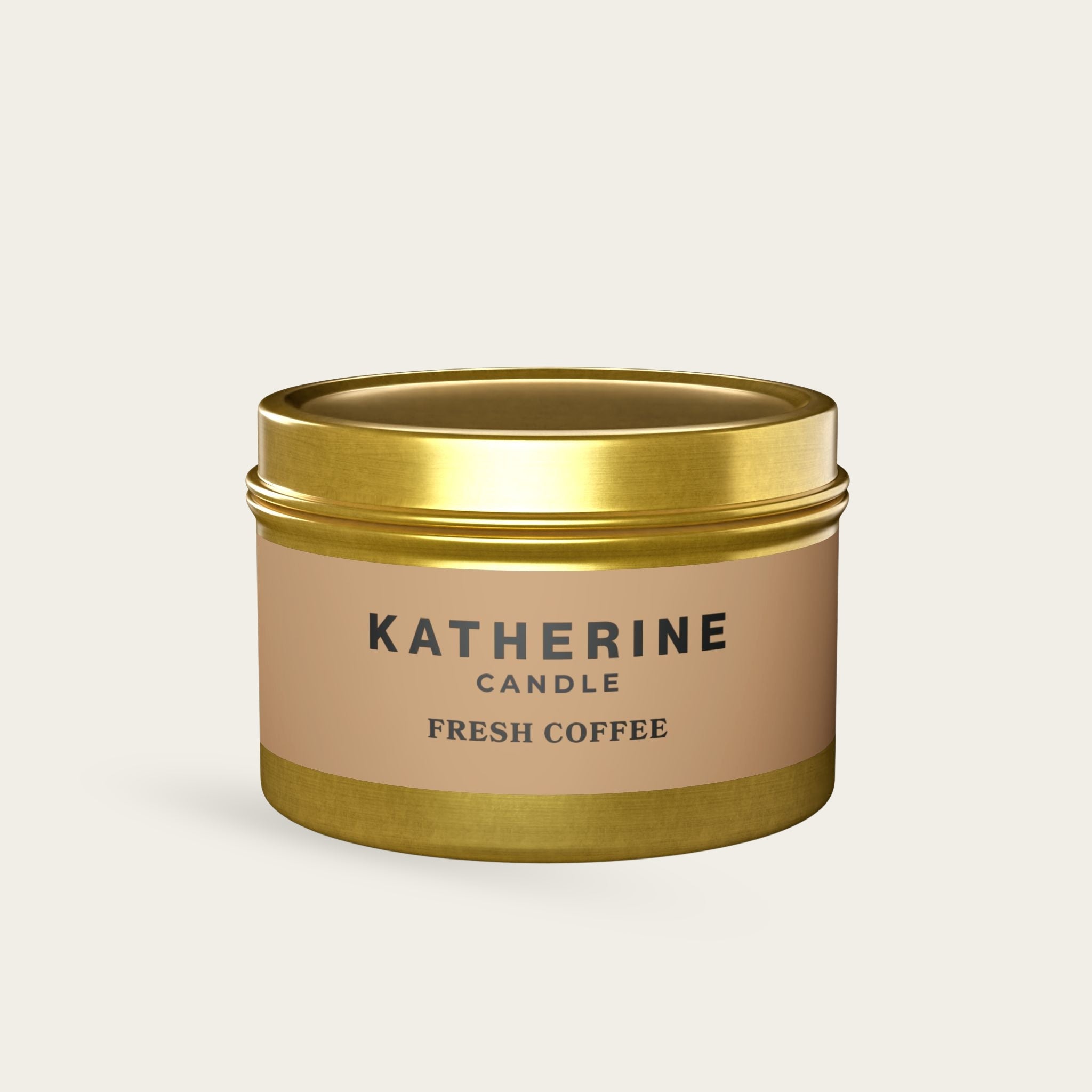 Gold-lidded candle jar with beige label reading KATHERINE FRESH COFFEE