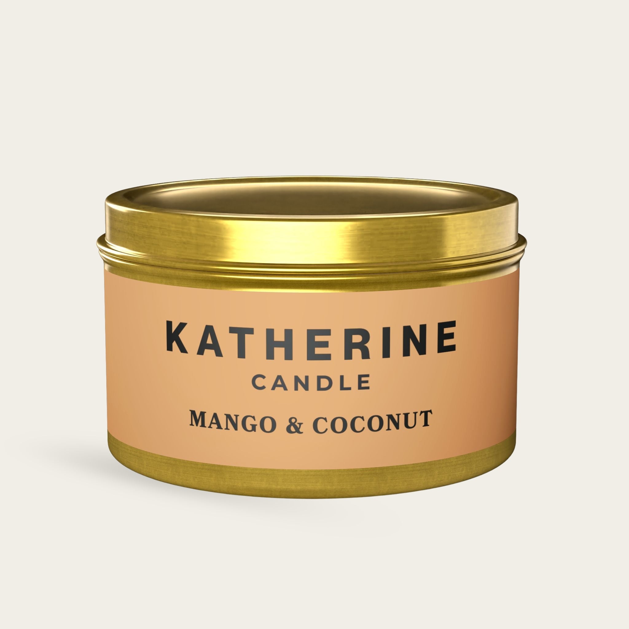 Gold candle jar with reflective gold lid and Mango & Coconut label