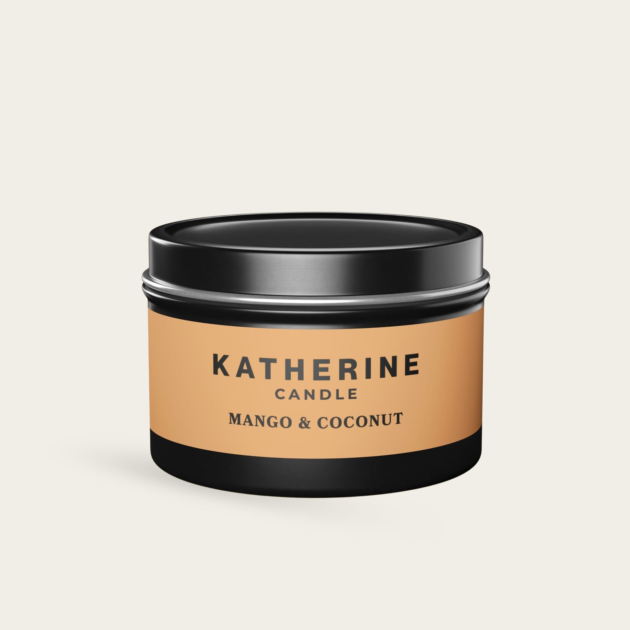 Black candle jar with matte black lid and Mango & Coconut label
