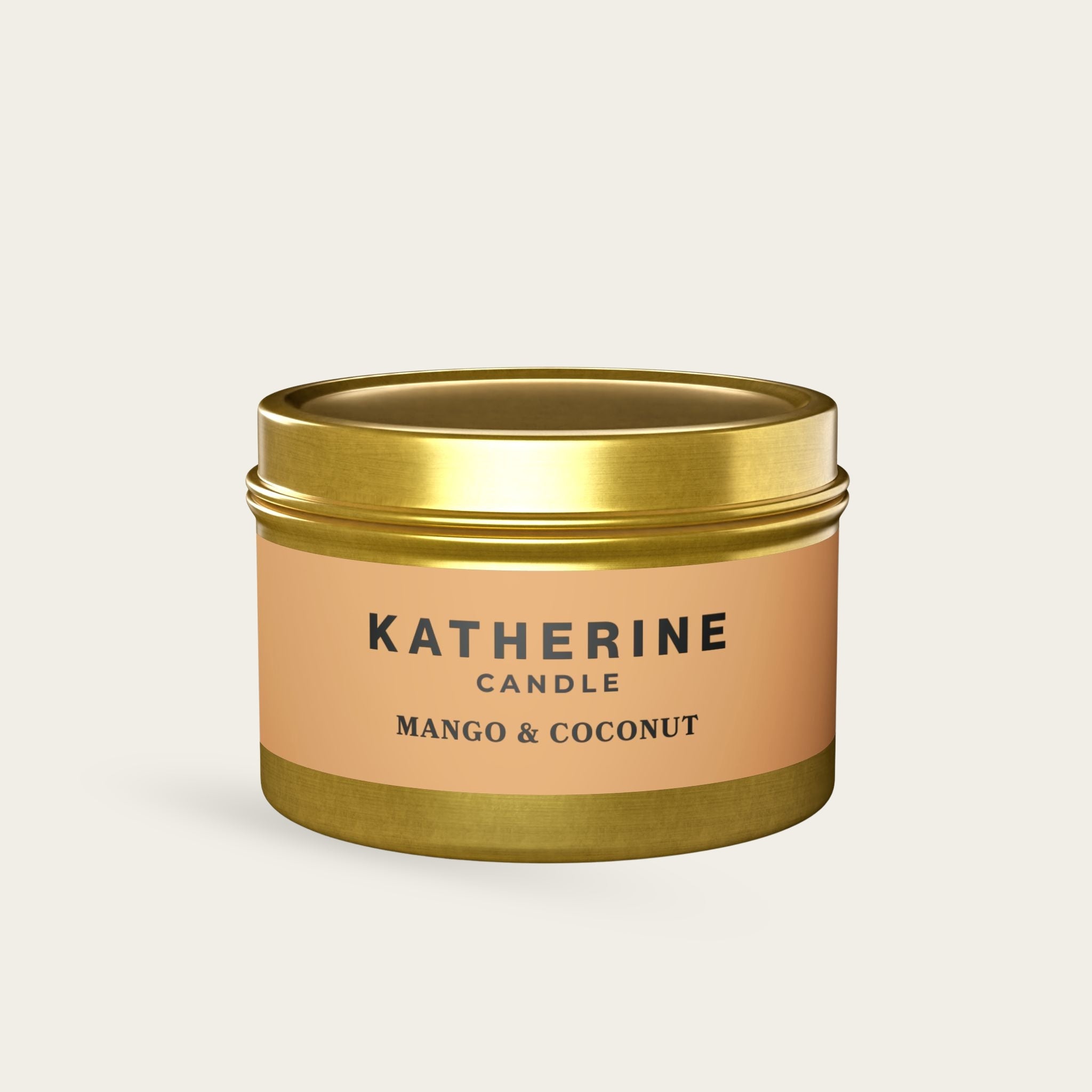 Gold candle jar with gold lid and Mango & Coconut label