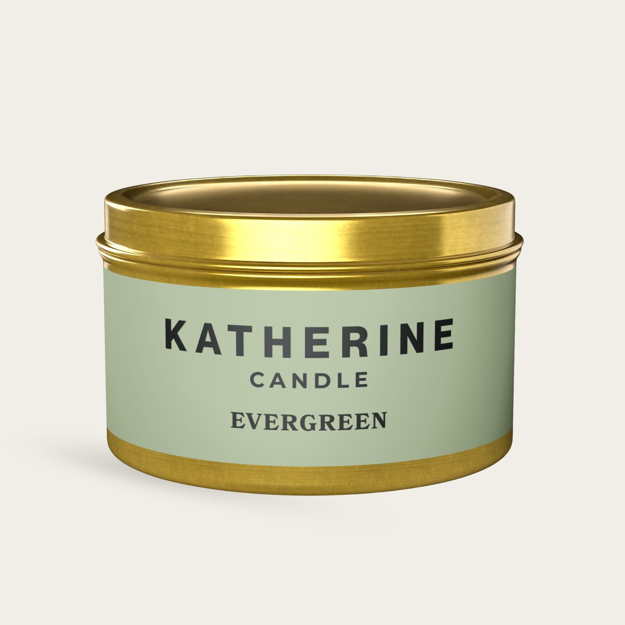 Evergreen candle in gold metal tin with green label, KATHERINE CANDLE and EVERGREEN