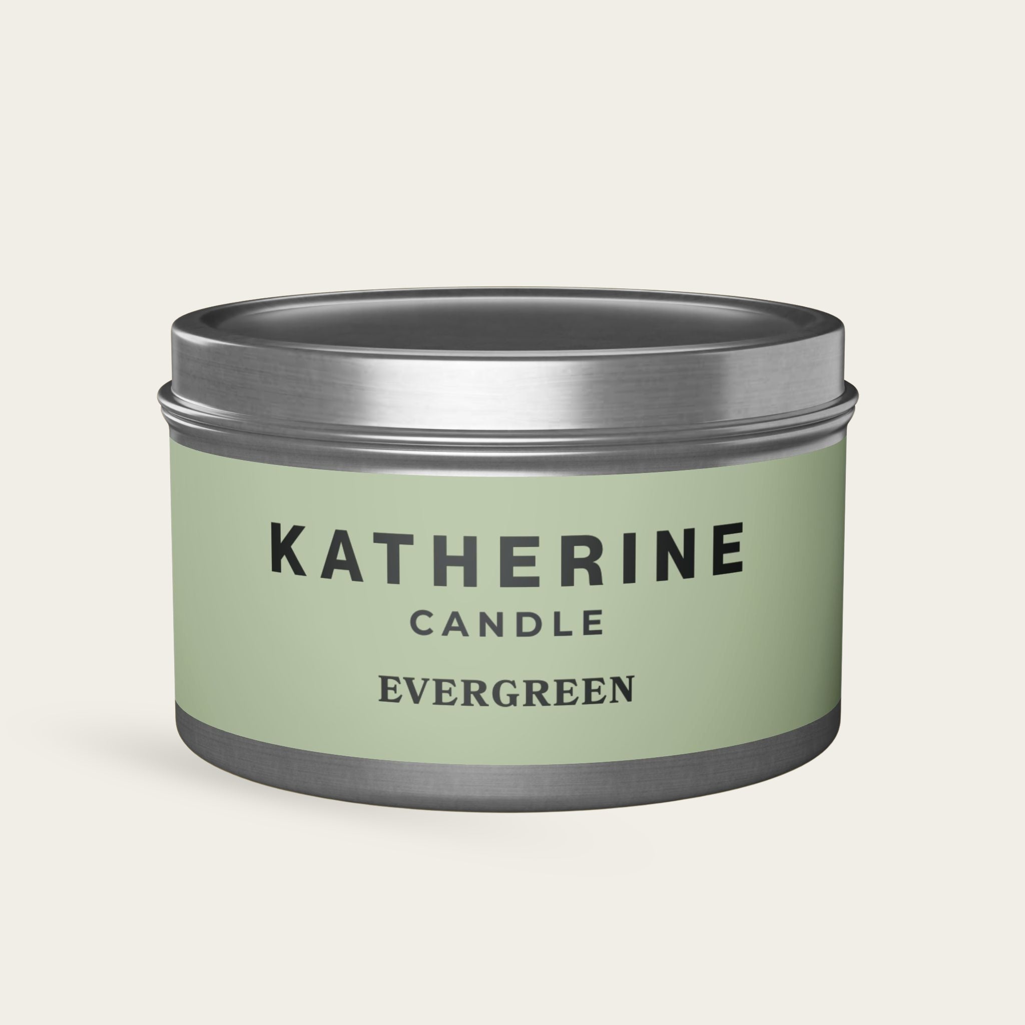 Evergreen candle in silver metal tin with green label, KATHERINE CANDLE and EVERGREEN